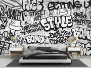 Graffiti wall mural with black-and-white street art typography and spray paint elements, ideal for urban-inspired bedrooms or creative spaces.