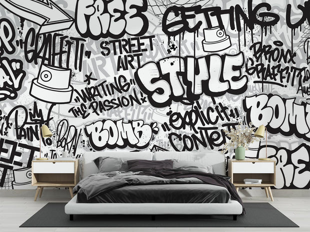 Graffiti wall mural with black-and-white street art typography and spray paint elements, ideal for urban-inspired bedrooms or creative spaces.