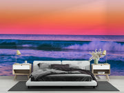 Tropical Ocean Sunset Wall Mural – Vibrant Seascape Wallpaper Featuring Rolling Waves, a Pink-Orange Twilight Sky, and a Relaxing Coastal Ambiance for Modern Interiors.