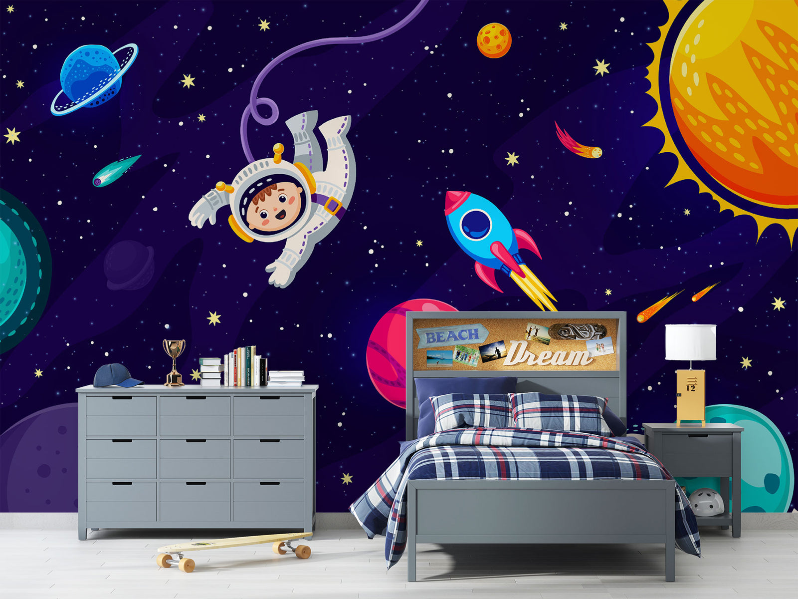 Cosmic explorer wall mural with cartoon astronaut, rocket ship, planets, and starry galaxy background in a playful kids’ bedroom.