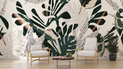 Lush foliage wall mural with bold green, beige, and rust botanical patterns and abstract dotted accents.