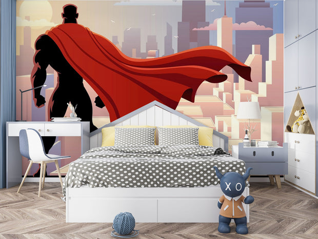 Wall mural depicting a superhero in a red cape looks over the city.