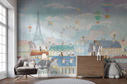 Paris-themed kids’ wall mural with the Eiffel Tower, hot air balloons, colorful rooftops, and kites in soft pastel colors, perfect for a nursery or playroom.