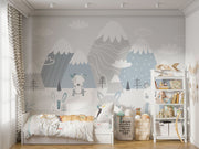 Scandinavian-style nursery wall mural featuring snowy mountains, foxes, rabbits, and a bear in soft pastel tones. Perfect for a cozy and modern kids’ room or baby nursery.