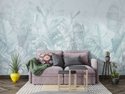 Soft blue palm leaf wall mural featuring oversized banana leaves on a light pastel background, perfect for modern interiors.