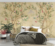 Elegant chinoiserie-style wall mural featuring delicate tree branches, blooming flowers, and colorful birds on a vintage beige background