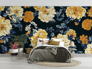 Midnight bloom wall mural featuring large yellow and cream flowers with deep blue foliage on a dark background, creating a dramatic and elegant room atmosphere.