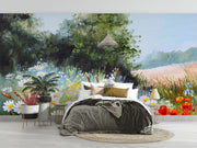 Hand-painted wall mural featuring a summer meadow with wildflowers, daisies, tall grass, and a soft blue sky, creating a peaceful countryside scene.