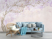 Soft pink and lavender floral wall mural with delicate blossoms on intertwining branches, creating a serene and elegant ambiance.