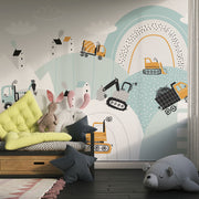 Construction site wall mural with trucks, diggers, and cranes in a pastel blue and orange theme, ideal for kids’ room decor.