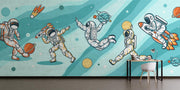 Playful astronaut-themed wall mural featuring astronauts, rockets, planets, and comets, ideal for kids’ bedroom or playroom decoration.