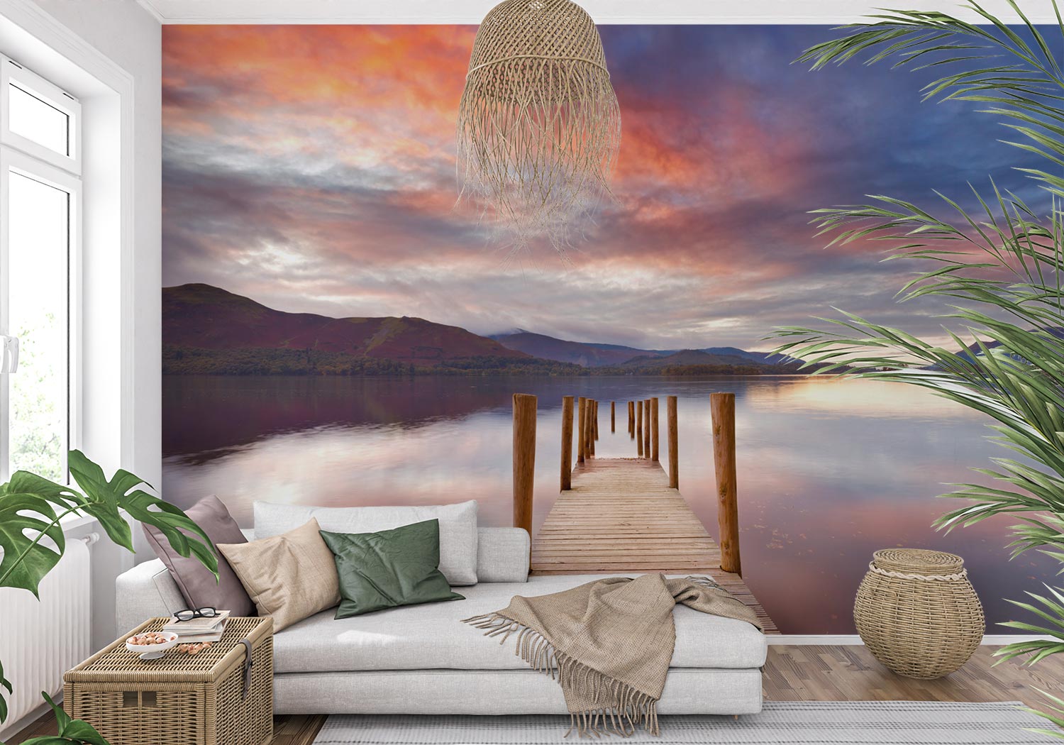 Wall mural of a sunset lake with a wooden dock extending into calm waters, adding warmth to a modern living room.