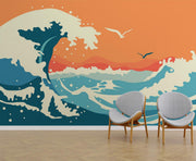 Abstract ocean wave wall mural and wallpaper in vibrant orange and blue tones, styled in a living room with two chairs.