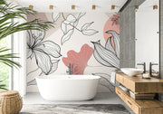 Modern bathroom with a freestanding bathtub, floral wallpaper, and wooden vanity.