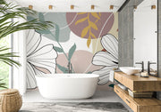 Modern bathroom with a freestanding bathtub, wooden vanity, and decorative wall art.