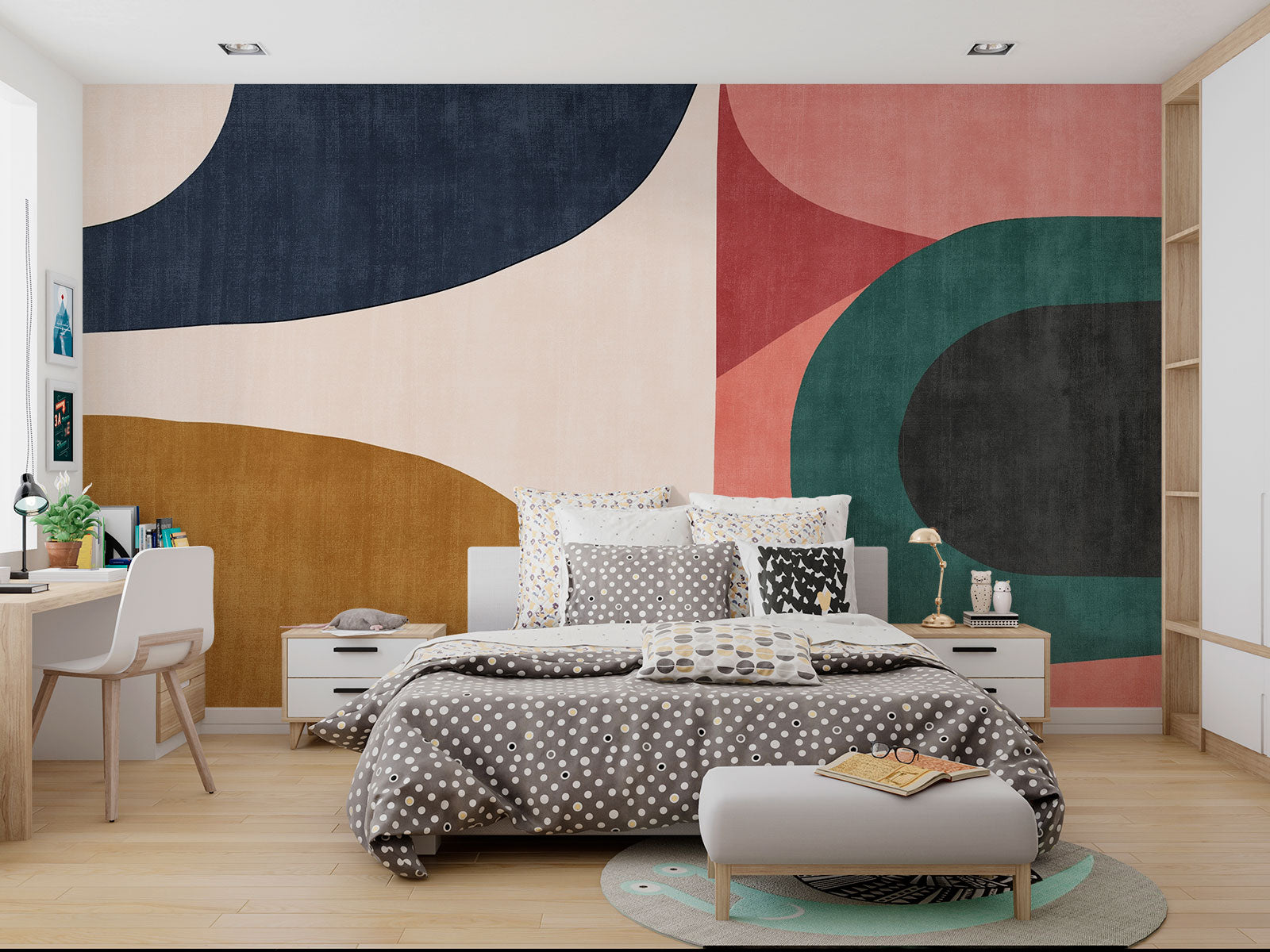 Earthy geometric wall mural with abstract curved shapes in green, ochre, navy, and blush, creating a modern and minimalist bedroom atmosphere.
