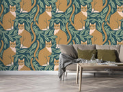 Whimsical wall mural featuring orange cats surrounded by green leaves, adding playful charm to a modern living room.