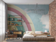 Modern bedroom with retro pastel rainbow wall mural and sky backdrop.