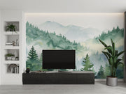 Watercolor forest wall mural with misty mountains and lush green trees, creating a serene and calming nature-inspired ambiance.
