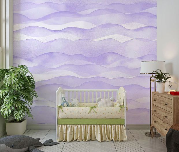 Purple wave-pattern wall mural with soft flowing designs, decorating a cosy children’s nursery.