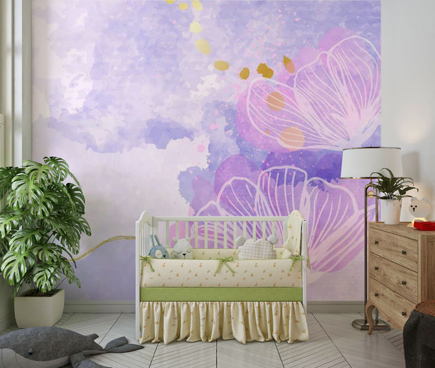 Watercolor flower-themed mural in pink, purple, and lavender with gold accents, decorating kid's nursery.