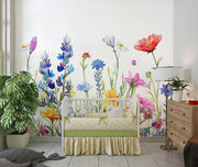 Watercolor wildflower wall mural featuring hand-painted flowers in vibrant colors with butterflies, styled in a playful children’s room with a white teepee.