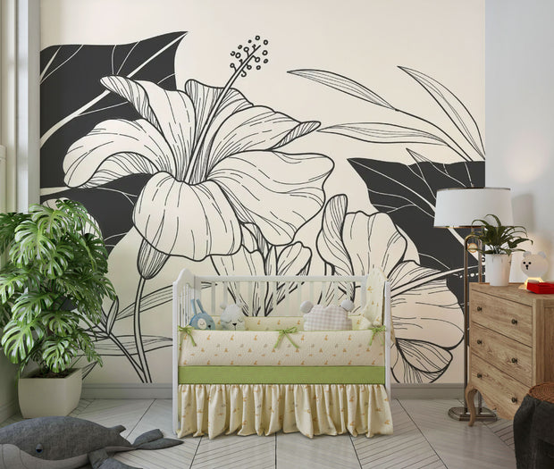 Calm nursery scene with crib and large-scale botanical line art mural in black and cream tones.