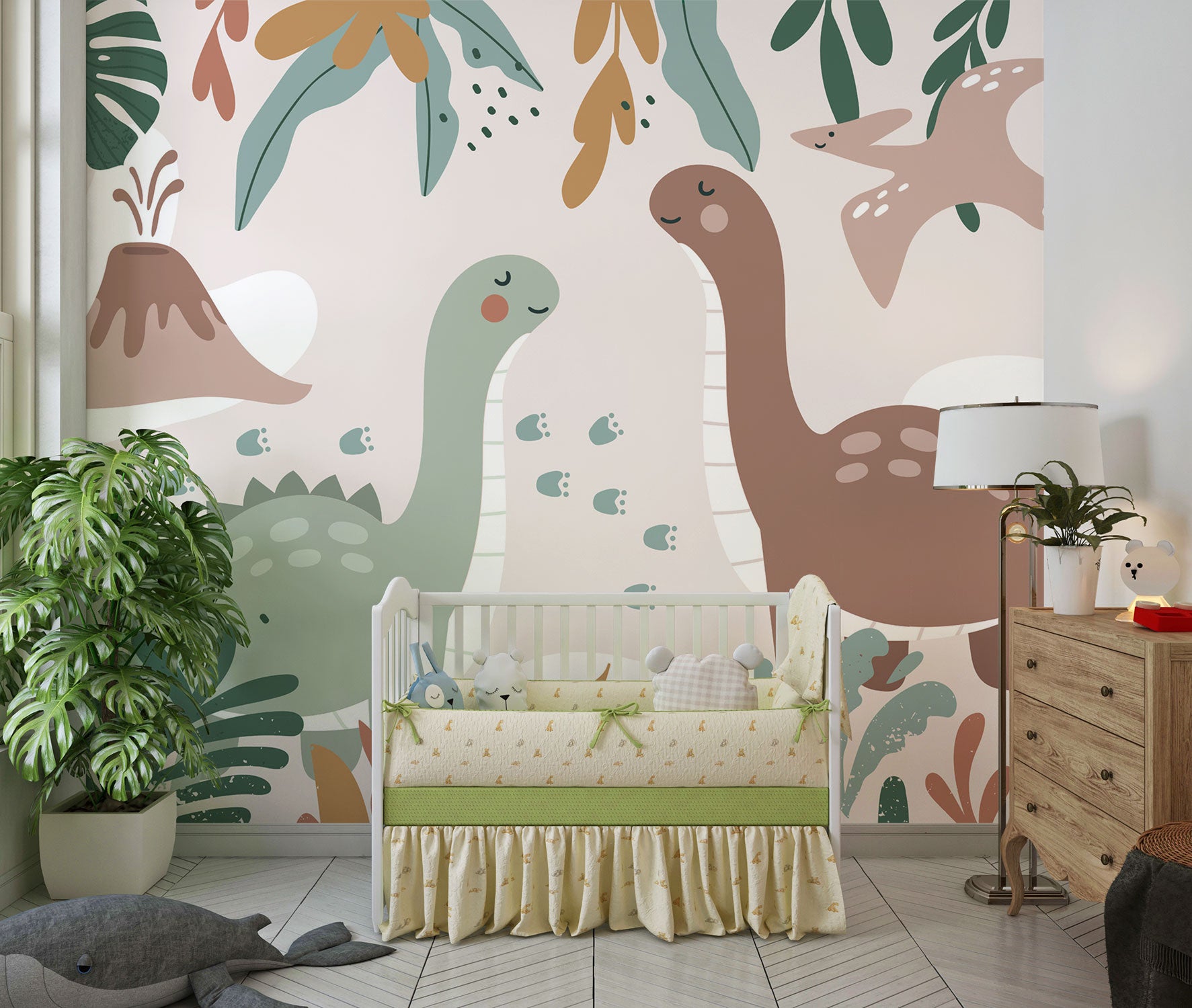 Kids’ wall mural with cartoon dinosaurs, volcano, pterodactyl, and tropical leaves in soft earth tones; styled in a cozy children’s nursery.