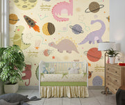 Nursery with Dino Galaxy Wall Mural featuring whimsical dinosaurs, rockets, planets, and stars in pastel colors, creating a magical space-themed decor.