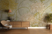 Art Nouveau floral wall mural with intricate yellow and beige chrysanthemum flowers on a sage-green background, styled in a modern living space.