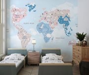 Pastel dinosaur world map wall mural featuring adorable prehistoric creatures, soft blue and pink tones and a whimsical design; perfect for kid's rooms and nurseries.