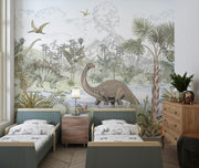Prehistoric dinosaur wall mural featuring a jungle scene with a Brachiosaurus, Stegosaurus, pterodactyls, and a volcano in a children’s room.