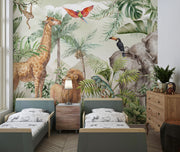 Tropical safari wall mural with exotic animals, including an elephant, giraffe, lion, toucan, and parrot, surrounded by lush tropical leaves and greenery – perfect for kid's rooms and nature-inspired interiors.