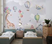 Safari-themed wall mural with watercolor animals, hot air balloons, and a pastel sky—ideal for nursery and kids' room décor.
