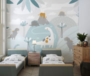 Pastel dinosaur wall mural with friendly dinosaurs, volcano, and soft greenery in muted colors, ideal for decorating nurseries, playrooms, and kids’ bedrooms.
