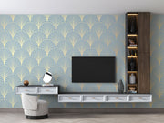 Modern living room with a television mounted on a decorative wall featuring geometric patterns.