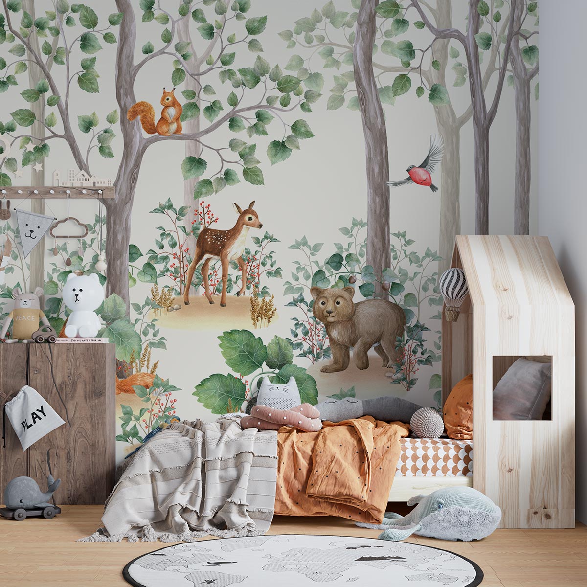 Woodland-themed wall mural featuring a bear cub, deer, squirrel, birds and lush green trees, decorating a cozy children's bedroom with a wooden house bed and natural decor.