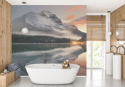 Escape into nature with the Majestic Mountain Lake Wall Mural. Featuring a serene mountain reflection at sunset, perfect for bedrooms and living spaces.