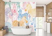 Multicolor zebra wall mural featuring vibrant pink, blue, orange, and yellow zebras on a white background, ideal for modern decor.