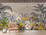 Modern tropical botanical wall mural with grayscale jungle leaves, vibrant yellow flowers, and a misty mountain backdrop in a cozy bedroom setting.