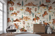 Wild West cowboy wall mural featuring galloping horses, cowboys, cacti, and Western landscapes in a vintage-style wallpaper design.