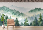 Watercolor forest wall mural with misty mountains and lush green trees, creating a serene and calming nature-inspired ambiance.
