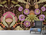 Opulent bloom wall mural with intricate lilac, peach, and green flowers on a dark background in a living room with a black chair.