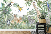 Safari adventure wall mural featuring watercolor jungle animals such as lions, giraffes, zebras, and parrots, styled in a cozy kids' playroom.