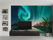 Northern lights wall mural featuring green and blue auroras over snowy mountains and a frozen lake, creating a mesmerizing and tranquil atmosphere.