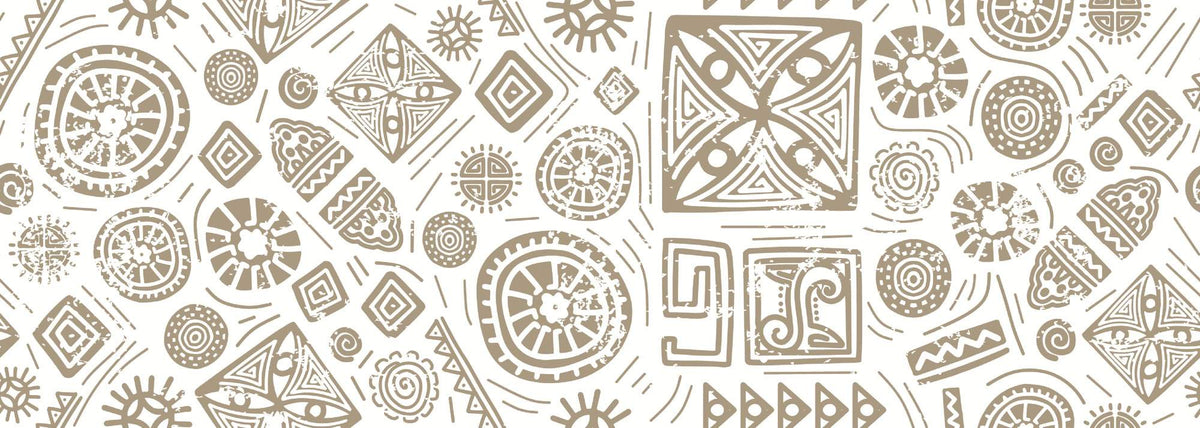 Modern tribal geometric wall mural in gold and white with abstract patterns, styled in contemporary living room with blush chair