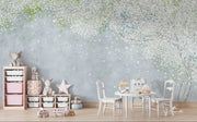 Soft blue and green wall mural with delicate white blossoms, creating a peaceful and elegant ambiance.