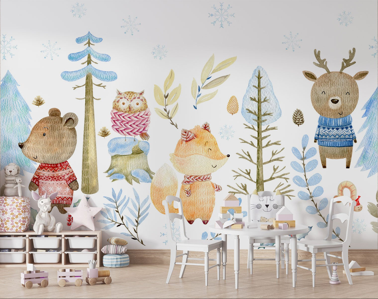 Winter woodland animal wall mural featuring a bear, fox, deer, and owl in cozy knitted sweaters, surrounded by snow-covered trees and soft blue foliage.