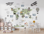 Scandinavian style children's world map wall mural with cute animals and airplanes, styled in a kid's playroom.