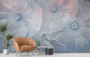 Ethereal large-scale poppy wall mural in soft blues and pinks, styled in a modern minimalist living room.